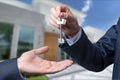 Landlord unlocks the house key for new home.