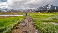 Landmannalaugar, Iceland. Camping site and mountain hut, tents, cars, campers at beautiful Icelandic landscape of colorful rainbow Royalty Free Stock Photo