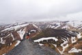 Unidentified tourist drinking water at Landmannalaugar in Iceland.