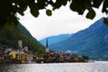 Landmark of Austrian town on the lake suranded with mountains.