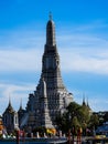 Landmark of Bangkok, Thailand, Wat Arun on Chao Phraya river with blue sky backgrounds.