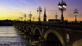 Pont de Pierre bridge in Bordeaux at sunset as the night sky scene Royalty Free Stock Photo