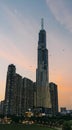 Landmark 81 Tower in Ho Chi Minh City at sunset, with kites flying