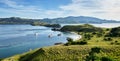 Landmark view of `Gili Lawa` with green savanna grass and blue sea in an evening, Komodo Island Komodo National Park, Labuan Baj