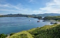 Landmark view of `Gili Lawa` with green savanna grass and blue sea in an evening, Komodo Island Komodo National Park, Labuan Baj