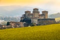 Landmarks of italy, the Torrechiara fantasy castle near Parma - Italy with yellow warm toned grass and sky vintage look