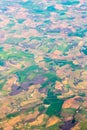 Lands aerial view. Mosaic golden fields and green meadows