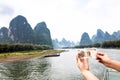 Li River and 20 Yuan Bill. The landscape depicted on the banknote is identical to the landscape surrounding the river. China 