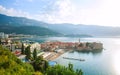 Landscape aerial view on roofs of old historical town of Budva and sea bay, mountains and forests of Montenegro, on background of Royalty Free Stock Photo