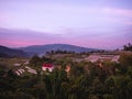 Landscape of agricultural areas of people in Fang district, Chiang Mai, Thailand from the top of the mountain in the evening on Royalty Free Stock Photo