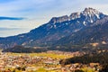 Landscape in the Alps with fresh green mountain pastures and snow-capped mountain tops in the background. Tyrol, Austria Royalty Free Stock Photo