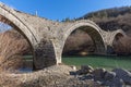 Landscape of Ancient Bridge of Missios in Vikos gorge and Pindus Mountains, Zagori, Epirus, Greece Royalty Free Stock Photo