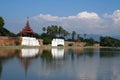 Landscape Ancient brown brick Palace wall with sugar palm tree and Moat surrounding of Mandalay palace located in Mandalay, Burma