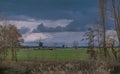 Landscape with ancient windmills in the Netherlands in gloomy spring weather. Stormy day over Dutch village of Streefkerk Royalty Free Stock Photo