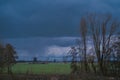 Landscape with ancient windmills in the Netherlands in gloomy spring weather. Stormy day over Dutch village of Streefkerk Royalty Free Stock Photo