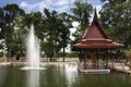 Landscape and antique style pavilion and fountain in water pond pool for thai travelers people rest relax in garden patio park of Royalty Free Stock Photo