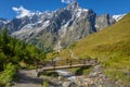 Landscape of Aosta valley near Mont Blanc massif with river and bridge, Italy Royalty Free Stock Photo