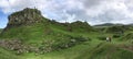 Landscape around Faerie Castle (Castle Ewen) at Fairy Glen in Isle of Skye in Scotland, UK with unrecognizable tourists