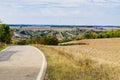 Landscape and asphalt road along populair route in Germany, called Romantische Strasse