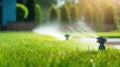 Landscape automatic garden watering system with different rotating sprinklers installed on turf. Landscape design with