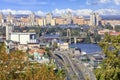 The landscape of the autumn city of Kyiv with a view of the Dnipro River, many bridges, the old Podilsky district and new houses Royalty Free Stock Photo