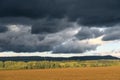 landscape in autumn, dark clouds and golden sun over agrultural fields near GÃ¶ttingen, Germany