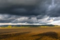 landscape in autumn, dark clouds and golden sun over agrultural fields near GÃ¶ttingen, Germany