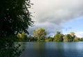 landscape in autumn, dark clouds and golden sun over a small lake in Klein Schneen, Friedland,