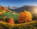 Landscape with autumn trees, village with houses, church, meadows Royalty Free Stock Photo
