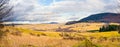 Landscape with autumnal meadows and hills Royalty Free Stock Photo