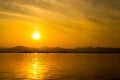 The landscape Background of a golden sunset reflect water and silhouette mountain in west lake xihu in Hangzhou CHINA - Image Royalty Free Stock Photo