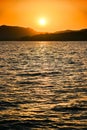 The landscape Background of a golden sunset reflect water and silhouette mountain in west lake xihu in Hangzhou CHINA - Image Royalty Free Stock Photo