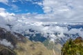Landscape background with mountains in the clouds from the top of the Machu Piccu mountain Royalty Free Stock Photo