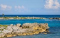 Landscape with balanced rocks, stones on a rocky coral pier. Turquiose blue Caribbean sea water. Riviera Maya, Cancun, Mexico.