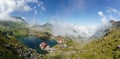 Landscape with Balea lake and chalet in Fagaras mountains Royalty Free Stock Photo