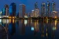 View of Bangkok building on the bank of the Chao Phraya river at night.