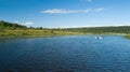 Landscape of banks of the river, speed boat on the river, summer day. View from above. Volga river Russia Royalty Free Stock Photo