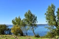 Landscape with bay, green field and trees. Blue sea and clear sky, sunny day. Galicia, Coruna Province, Spain. Royalty Free Stock Photo