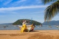 Landscape with the beach of Brazil on the island of Ilha Grande. Fishing boats and people in a paradise of the Atlantic Ocean Royalty Free Stock Photo