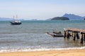 Landscape with the beach of Brazil on the island of Ilha Grande. Fishing boats and people in a paradise of the Atlantic Ocean Royalty Free Stock Photo