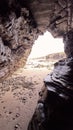 Landscape of a beach with rocky cliffs in Galicia from the interior of a cave