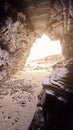 Landscape of a beach with rocky cliffs in Galicia from the interior of a cave