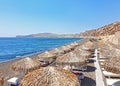 Landscape of beach at Santorini island called Mesa Pigadia with black volcanic sand