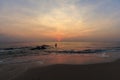 Landscape of beach and sea which has fisherman was fishing with net and cloudy sky in morning ; Songkhla, southern o Royalty Free Stock Photo