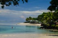 Landscape of a beach surrounded by palm trees and the sea in the Savai'i island, Samoa