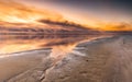 Landscape of a beach surrounded by water during the sunset on Cape Cod, Massachusets Royalty Free Stock Photo