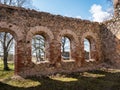 Landscape with beautiful abandoned church ruins, arched windows, stone walls, building without a roof Royalty Free Stock Photo