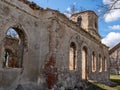 Landscape with beautiful abandoned church ruins, arched windows, stone walls, building without a roof Royalty Free Stock Photo