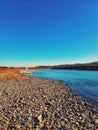 Beautiful sunset , fantastic colors and look at the surface of the river and a huge dry tree Royalty Free Stock Photo