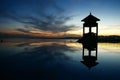 Landscape of beautiful infinity pool and sea and oriental gazebo. Amazing beach sunset with endless horizon and incredible Royalty Free Stock Photo